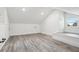 Cozy loft bedroom with built-in sleeping platform and window seat at 126 90Th Ave, Treasure Island, FL 33706