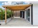 Backyard patio with wood pergola and tropical plants at 126 90Th Ave, Treasure Island, FL 33706