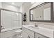 Modern bathroom with subway tile, quartz countertop, and shower at 13038 Paddock Woods Pl, Riverview, FL 33579