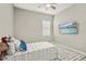 Bedroom featuring a twin bed and playful decor at 13038 Paddock Woods Pl, Riverview, FL 33579