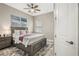 Main bedroom with a king-size bed and calming decor at 13038 Paddock Woods Pl, Riverview, FL 33579
