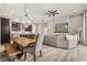 Open concept dining area with wooden table and bench, adjacent to the kitchen at 13038 Paddock Woods Pl, Riverview, FL 33579