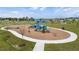 Modern playground with climbing structures and slides at 13038 Paddock Woods Pl, Riverview, FL 33579