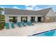 Relaxing pool area with lounge chairs and covered seating at 13038 Paddock Woods Pl, Riverview, FL 33579