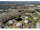 Complex with pond, parking and surrounded by lush trees at 1488 Pine Glen Ln # B2, Tarpon Springs, FL 34688
