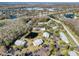 Community overview featuring a pond, landscaping, and ample parking at 1488 Pine Glen Ln # B2, Tarpon Springs, FL 34688