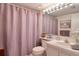 Clean bathroom with shower/tub combo and updated vanity at 1488 Pine Glen Ln # B2, Tarpon Springs, FL 34688