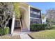 Well-maintained condo building with lush landscaping at 1488 Pine Glen Ln # B2, Tarpon Springs, FL 34688