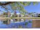 Community features tranquil pond views and lush landscaping at 1488 Pine Glen Ln # B2, Tarpon Springs, FL 34688