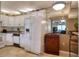 Kitchen with white cabinets, granite countertops, and a refrigerator at 1488 Pine Glen Ln # B2, Tarpon Springs, FL 34688
