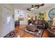 Relaxing living room featuring hardwood floors and comfortable leather furniture at 1488 Pine Glen Ln # B2, Tarpon Springs, FL 34688