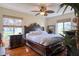Spacious main bedroom with a king-size bed and wood furniture at 1488 Pine Glen Ln # B2, Tarpon Springs, FL 34688