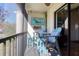 Enjoyable screened balcony with lake view and comfy seating at 1488 Pine Glen Ln # B2, Tarpon Springs, FL 34688