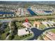 Aerial view of a house in Valencia Lakes community, featuring a landscaped yard at 15618 Aurora Lake Cir, Wimauma, FL 33598