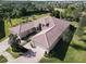 Aerial view of a house, showcasing its design and landscaping at 15618 Aurora Lake Cir, Wimauma, FL 33598