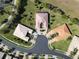 Neighborhood view showcasing various house styles and landscaping at 15618 Aurora Lake Cir, Wimauma, FL 33598