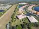 Aerial view of a home with a large backyard backing up to a conservation area at 15618 Aurora Lake Cir, Wimauma, FL 33598