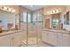 Bathroom with double vanity, granite countertop, and shower at 15618 Aurora Lake Cir, Wimauma, FL 33598