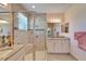 Double vanity bathroom with large shower at 15618 Aurora Lake Cir, Wimauma, FL 33598