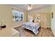 Bedroom with built-in wardrobe and floral bedding at 15618 Aurora Lake Cir, Wimauma, FL 33598
