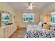 Main bedroom with large bed and built-in wardrobe at 15618 Aurora Lake Cir, Wimauma, FL 33598