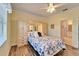 Bedroom with built-in wardrobe and ensuite bathroom at 15618 Aurora Lake Cir, Wimauma, FL 33598