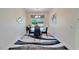 Bright dining room with table and chairs, view to backyard at 15618 Aurora Lake Cir, Wimauma, FL 33598
