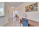 Bright and airy foyer featuring a desk, neutral walls, and tile floors at 15618 Aurora Lake Cir, Wimauma, FL 33598