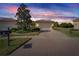 Attractive single-story home with a two-car garage and landscaped front yard at 15618 Aurora Lake Cir, Wimauma, FL 33598