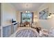 Bright home office features built-in cabinetry and a view of the backyard at 15618 Aurora Lake Cir, Wimauma, FL 33598