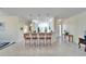 Kitchen features granite countertops, white cabinets, and breakfast bar at 15618 Aurora Lake Cir, Wimauma, FL 33598