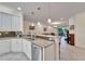 Open kitchen with granite counters, stainless steel appliances, and island at 15618 Aurora Lake Cir, Wimauma, FL 33598