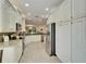 Modern kitchen with stainless steel appliances and granite countertops at 15618 Aurora Lake Cir, Wimauma, FL 33598