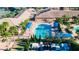 Resort-style pool, clubhouse, and tennis courts at 15618 Aurora Lake Cir, Wimauma, FL 33598