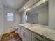 Bathroom boasting white cabinets and quartz countertop at 1566 Long St, Clearwater, FL 33755