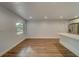 Spacious dining room with hardwood floors and access to kitchen at 1566 Long St, Clearwater, FL 33755