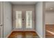 Inviting entryway with double doors featuring glass accents at 1566 Long St, Clearwater, FL 33755