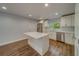 Updated kitchen featuring white cabinets and quartz countertops at 1566 Long St, Clearwater, FL 33755