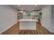 Modern kitchen featuring white cabinets, quartz countertops, and stainless steel appliances at 1566 Long St, Clearwater, FL 33755