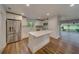 Renovated kitchen with island, stainless steel appliances, and white cabinets at 1566 Long St, Clearwater, FL 33755