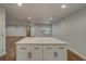 Modern kitchen with white island and quartz countertops at 1566 Long St, Clearwater, FL 33755
