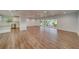 Open concept living space with hardwood floors and kitchen views at 1566 Long St, Clearwater, FL 33755