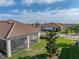 Aerial view of house highlighting the backyard and screened porch at 16931 Scuba Crest St, Wimauma, FL 33598