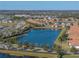 Community overview showcasing lakefront homes and landscaped streets at 16931 Scuba Crest St, Wimauma, FL 33598
