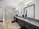 Double vanity bathroom with granite countertop at 16931 Scuba Crest St, Wimauma, FL 33598