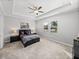 Spacious bedroom with carpeted floor and large windows at 16931 Scuba Crest St, Wimauma, FL 33598