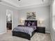 Main bedroom with en-suite bathroom and window at 16931 Scuba Crest St, Wimauma, FL 33598
