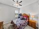 Bright bedroom with a double bed and wooden nightstand at 16931 Scuba Crest St, Wimauma, FL 33598