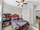 Cozy bedroom with double bed and built-in shelving at 16931 Scuba Crest St, Wimauma, FL 33598