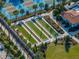 Aerial view of bocce ball courts and pickleball courts in a community at 16931 Scuba Crest St, Wimauma, FL 33598
